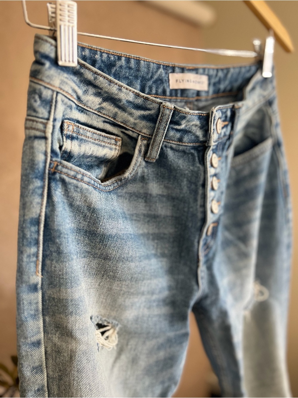 Minimalist Light Blue Women’s Distressed Mid-Rise Button-Fly Jeans